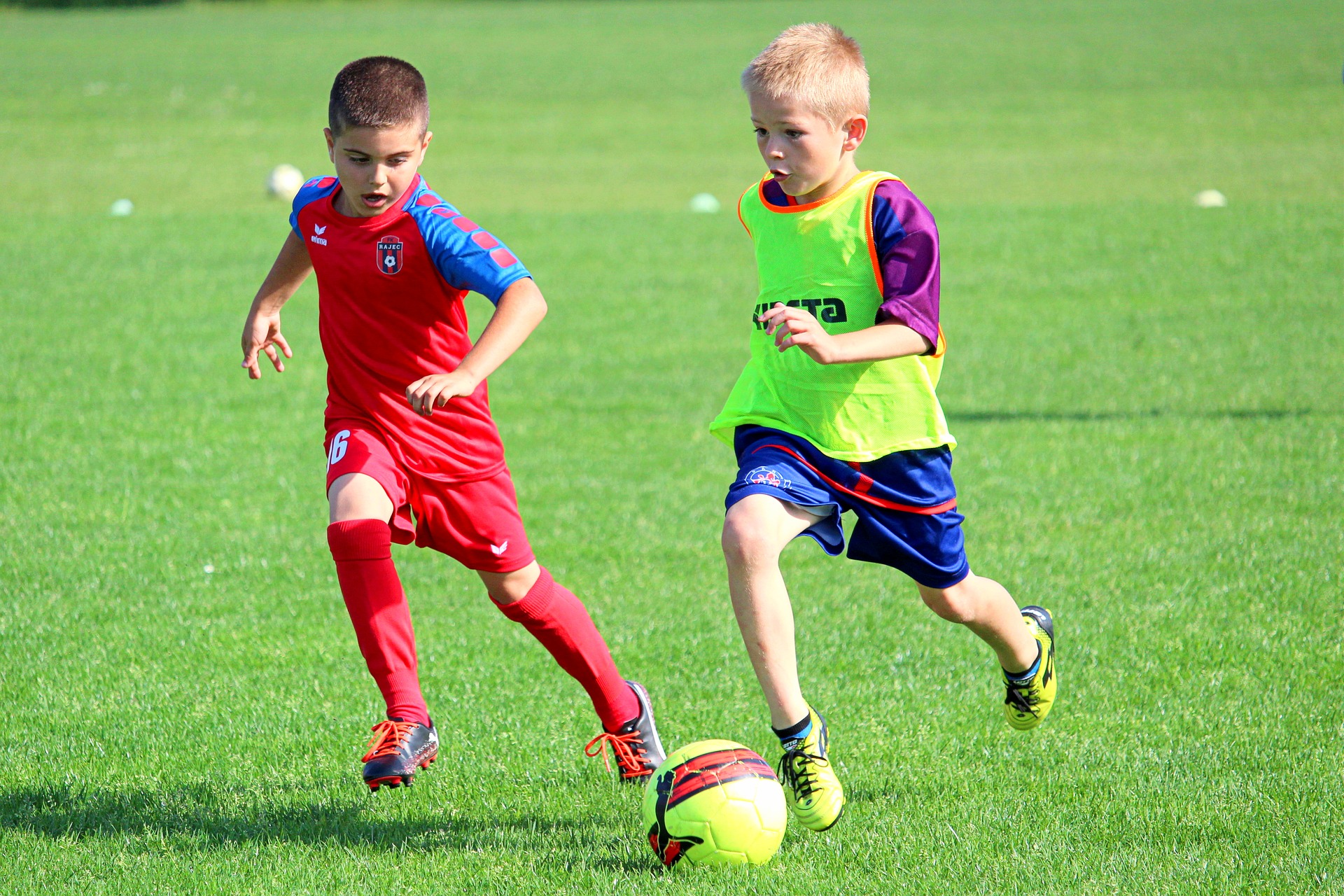 Two boys playing football